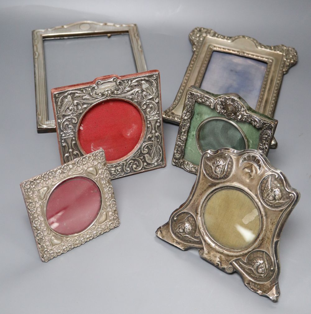 Five assorted early 20th century silver mounted photograph frames and a similar 1920s frame, largest 23.5cm.